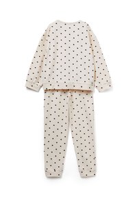 Conjunto de pijama beige con lunares que incluye un top de manga larga y pantalones a juego, confeccionado con un tejido suave y puños y cuello acanalados.