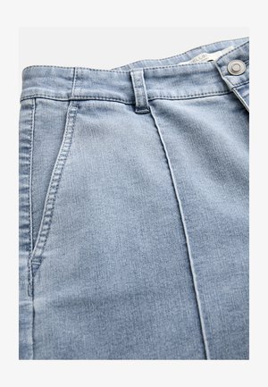 Light blue denim jeans with front pockets, belt loops, and a metal button closure at the waistband.