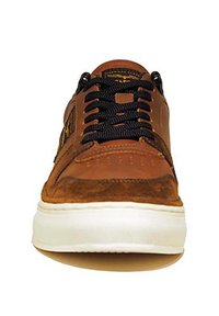 Brown suede and leather sneaker with black laces, white rubber sole, and a low profile. Features a textured toe cap and side detailing.