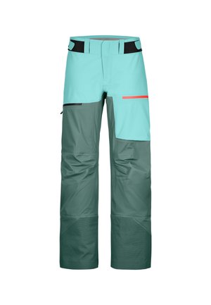 Zweifarbige Outdoor-Hosen in Türkis und Dunkelgrün mit schwarzen und roten Reißverschlusstaschen und verstellbaren Taillenbändern.