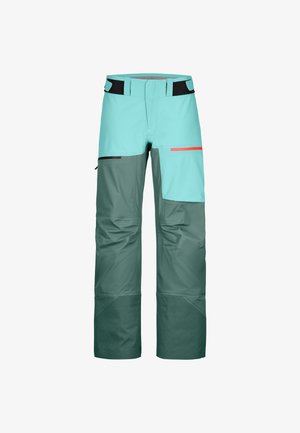 Zweifarbige Outdoor-Hosen in Türkis und Dunkelgrün mit schwarzen und roten Reißverschlusstaschen und verstellbaren Taillenbändern.
