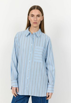 Light blue button-up shirt featuring vertical stripes in darker blue and brown, long sleeves, and a chest pocket with horizontal stripes.