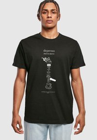 Black cotton t-shirt featuring white graphic design of a coffee-making process and text definition of "depresso" centered on the front.