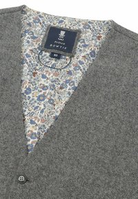 Gray textured vest with a floral patterned inner lining, featuring blue and peach flowers. Includes a single gray button and brand label.