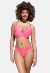Pink bra and matching panties with lace trim. The bra features smooth fabric and underwire support. Both pieces have a classic cut and design.