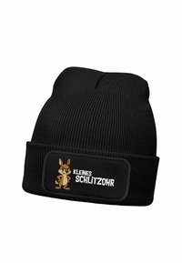 Black knitted beanie with a ribbed texture and a patch featuring a cartoon rabbit and the text "KLEINES SCHLITZOHR" in white.