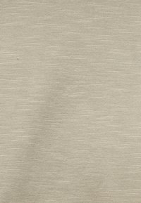 Υφασματικό ύφασμα ανοιχτού μπεζ χρώματος με υφή, ελαφρώς ετερογενές με απαλό πλεκτό μοτίβο. Κατάλληλο για ρούχα ή ταπετσαρίες. Ομαλή εμφάνιση.