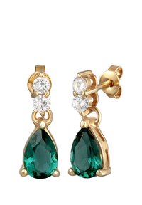 Des boucles d'oreilles en or avec des clous présentent deux pierres rondes transparentes au-dessus d'une pierre en forme de goutte d'eau de couleur verte. Fini lisse avec une apparence polie.