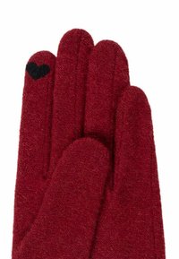 Red wool gloves with a soft texture, featuring a black heart accent on the tip of the thumb and neatly stitched seams.
