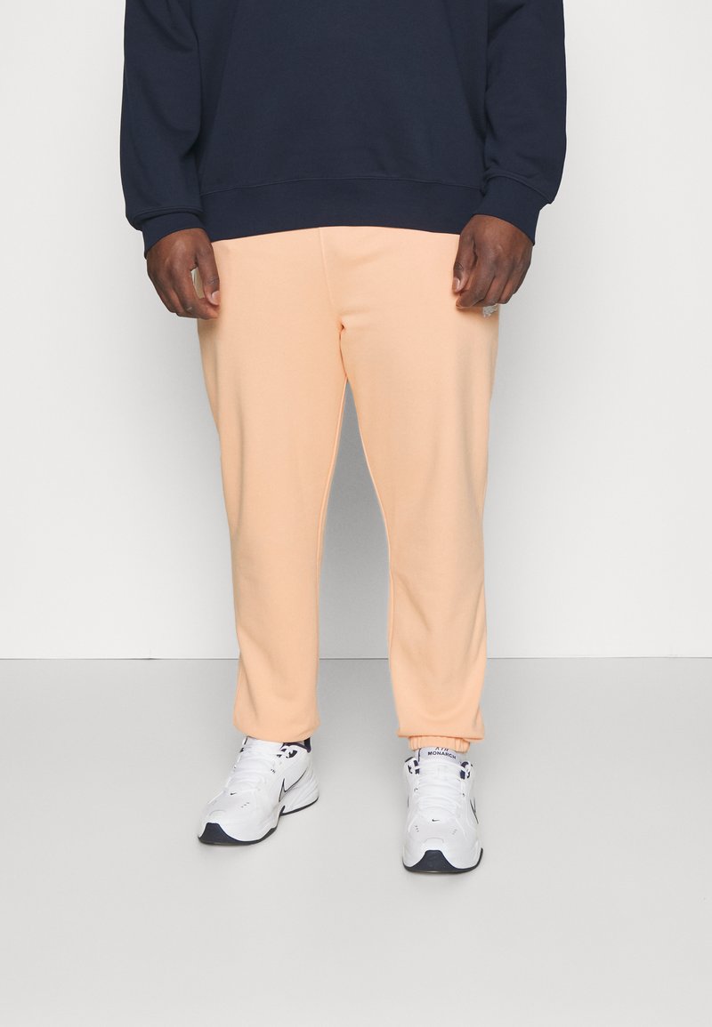 Lacoste PLUS Tracksuit bottoms salmon Zalando.ie