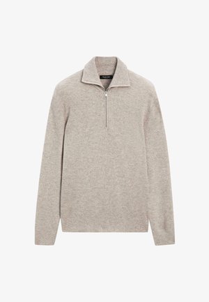 Pull en maille gris clair avec col à demi-fermeture éclair et manches longues. Présente une texture côtelée et une coupe ajustée. Aucun logo ou accent visible.