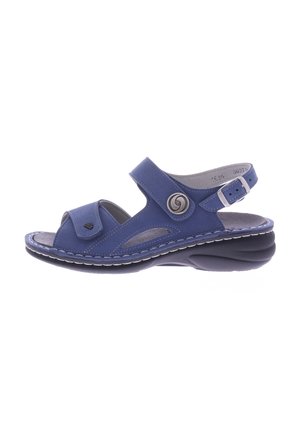 Blue sandal made of soft material with an open toe design, adjustable buckle, and cushioned insole; features decorative stitching and cutouts.