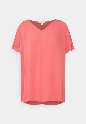 Coral pink V-neck top with short, ruffled sleeves and a relaxed fit. Made from soft fabric with a smooth texture. Rounded hem at bottom.