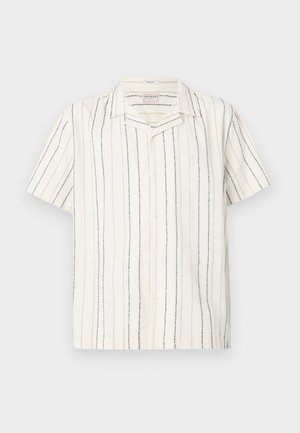 Short-sleeve, white button-up shirt with vertical black and beige stripes and a camp collar, displayed on a flat light background.