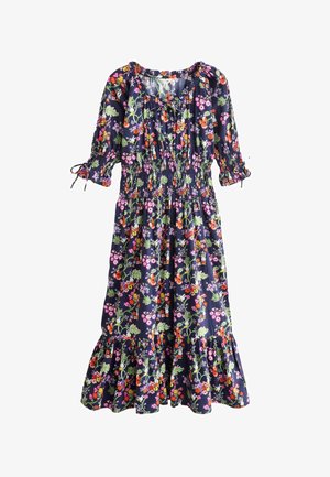 Laivastonsininen kukkamekko, jossa on lyhyet puffihihat, rypytetty kaula-aukko, smokkibodice ja röyhelöhelma. Kukkakuosi on monivärinen läpi mekon.