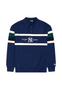 Mornarska polo majica z dolgimi rokavi iz bombaža, ki ima bele in zelene vodoravne črte. Vezen logo "New York Yankees" na prsih.