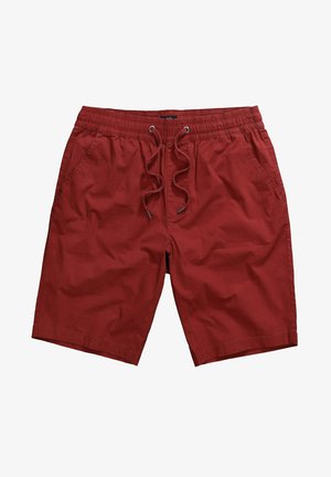 Punaiset lyhyet housut, jotka on valmistettu kevyestä kankaasta. Niissä on joustava vyötärönyöri ja kaksi sivutaskua, sekä suora leikkaus.