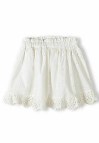 Jupe en coton blanc avec une taille élastique, ornée de broderies florales et d'un ourlet festonné avec des découpes. Légère et aérée.