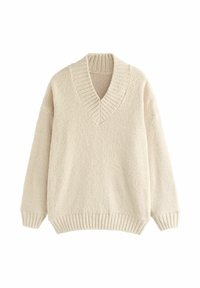 Krémový pulovr s výstřihem do V, ribovaným límcem a manžetami. Vyrobeno z měkké, strukturované látky s volným střihem a spadlými rameny.