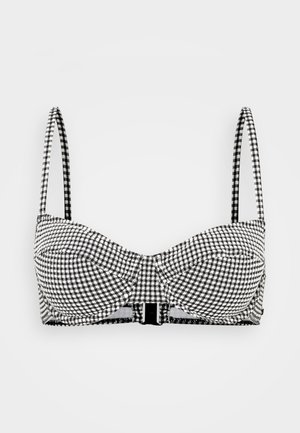 Black and white gingham print bra with molded cups, adjustable straps, and a hook closure in the back. Smooth fabric with a structured design.