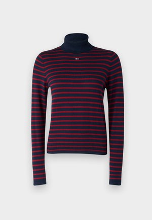 Jersey de cuello vuelto a rayas en tonos azul marino y rojo, confeccionado en un material de punto suave, con mangas largas y un diseño ajustado. Presenta un pequeño logo en el escote.