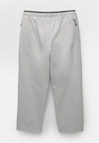 Grå sweatpants lavet af et blødt stof, med elastisk talje og sidelommer, med et enkelt design og lige snit.