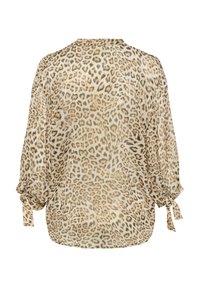 Bluse med leopardprint i let stof, med lange ærmer og bindebånd ved manchetterne. Neutrale nuancer af beige og brun.