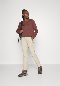Mammut RUNBOLD ZIP OFF PANTS WOMEN - Hlače za na prostem - savannah