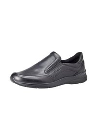 Svart lær slip-on sko med elastiske sidepaneler, rund tå og en teksturert gummisåle. Glatt overflate med subtile søm detaljer.