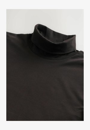 Mustmust särg, mille disain on paigaldatud. Valmistatud pehmest ja siledast kangast, see sisaldab kõrget kraed ja lühikesi varrukaid.