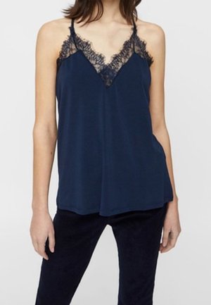 Navy blue camisole made of soft fabric, featuring a lace trim along the V-neckline and thin adjustable straps. Rounded hem design.