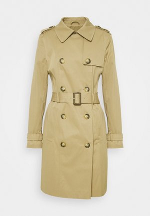 Trench-coat beige croisé avec ceinture, col, pattes d'épaule, poignets boutonnés et poches avant.