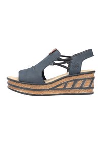 Black wedge sandals with cross-strap design, cork platform, and textured rubber sole. Features a prominent branded accent on the side.