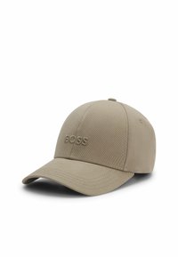 Khaki baseball cap made of fabric with a structured crown, curved visor, and tone-on-tone embroidered "BOSS" logo on the front.