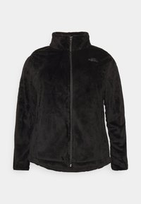 Giacca in pile nera con zip, colletto alto e logo The North Face sul lato sinistro del petto.