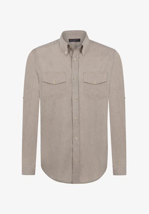 Jasno-beżowa koszula z długim rękawem, zapinana na guziki, wykonana z teksturowanej tkaniny, z dwiema kieszeniami na piersi oraz zaokrąglonym dołem. Posiada akcenty guzikowe oraz możliwość podwójnego zrolowania rękawów.