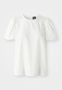 Blouse blanche à manches courtes avec manches bouffantes et bordure festonnée à l'encolure et aux extrémités des manches.
