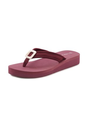 Mauve flip-flop sandal with a thick, textured sole, fabric straps, and a white square buckle detail on the upper strap.