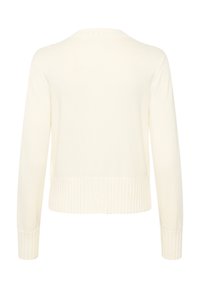 Krémová pletená cardigan s dlouhými rukávy, ribovanými manžetami a lemem. Hladká textura a jednoduchý design, bez zapínání nebo viditelných detailů.