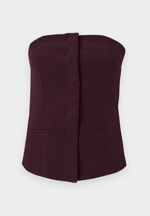 Burgundy strapless topp, figurnära design med en slät textur, med två framfickor och en rak halsringning.