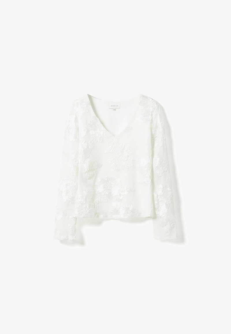 Weiße Bluse mit langen Ärmeln, V-Ausschnitt, bestickten Blumenmustern und leichtem Stoff mit leicht strukturierter Oberfläche.