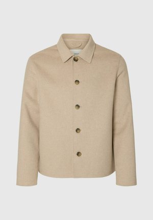 Bež sako od mješavine vune s ovratnikom, prednjim zatvaranjem na kopče i dugim rukavima. Ima šest okruglih kopči i teksturirani završetak.