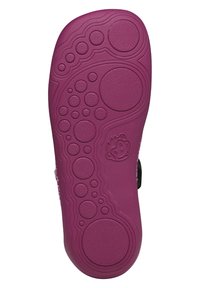 Rubber shoe sole in a deep purple hue, featuring textured circular patterns and a raised design, with a small logo on one side.