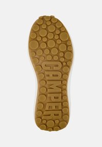 Rubber shoe sole in brown with circular textures and raised dots, featuring a large "CAMPER" logo and size "38" embossed.