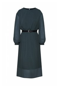 Tmavozelené šaty s bílými puntíky, dlouhými rukávy, elastickými manžetami, páskem v pase a rovnou siluetou. Zapínání na zip na zadní straně.