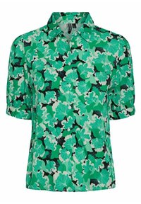 Blouse florale verte avec des manches courtes bouffantes, présentant un mélange de motifs de feuilles vert foncé, vert clair et noir sur un fond clair.