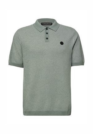 Vihreä, lyhythihainen poolopaita, jossa on teksturoitu neulos, kolmen napin aukko ja vasemmassa rinnassa musta pyöreä logo.