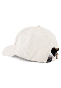 Beige színű baseball sapka ívelt karimával, hátsó állítható pánttal és diszkrét varrási részletekkel a sapka tetején és a karimán.