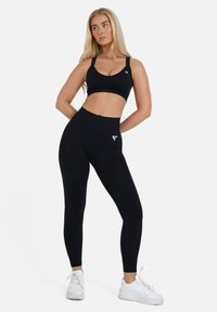 SQUATPROOF LEGACY SEAMLESS CROSS BACK - Sujetadores deportivos con sujeción media - black