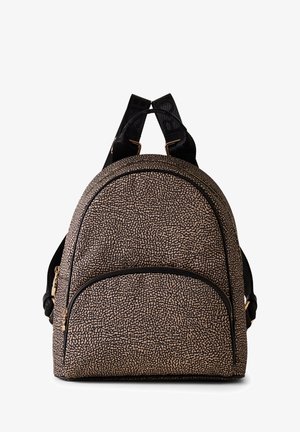 Backpack in a textured beige material with a dotted pattern, rounded shape, black accents, two straps, and a front zip pocket.